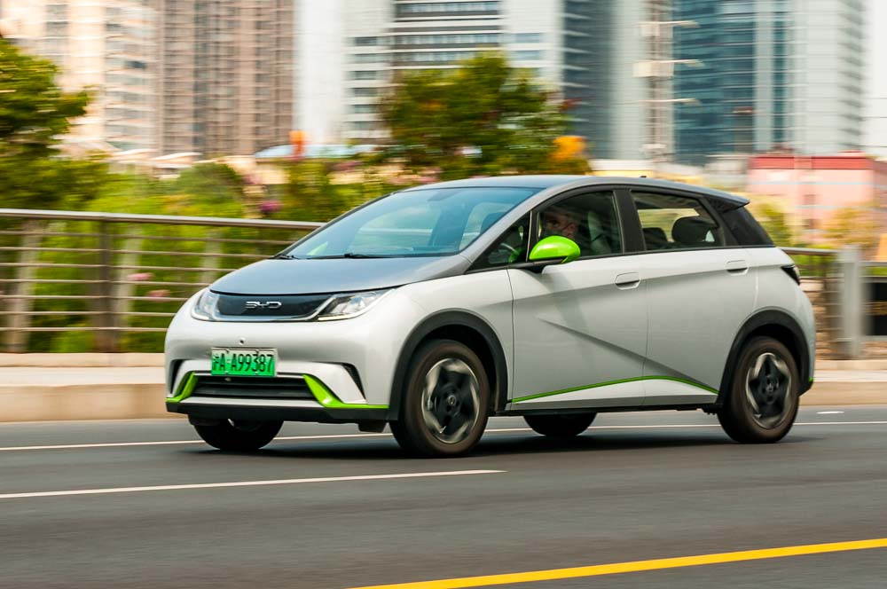 BYD Dolphin small electric hatchback car being driven on the road in Putuo District, Shanghai, China.